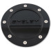 PartzBiz CM: FS3Z-6640526-SA-Drake Muscle Cars Black Fuel Door Shelby Logo